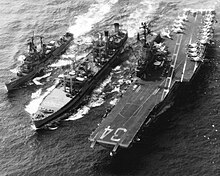 Oriskany conducts underway replenishment alongside the destroyer USS Morton during her 1974 WESTPAC cruise.