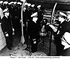 Lt. Eric Purdon, the ship's first commanding officer, reads the official orders directing him to assume command.