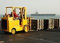 US Navy 030407-N-6817C-019 Sailors aboard USS Abraham Lincoln work to unload ammunition for transfer to USS Nimitz.jpg