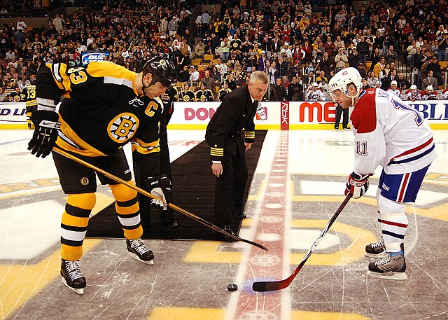 A ceremonial puck drop between Zdeno Chara and Saku Koivu before a Canadiens-Bruins game at the then-TD Banknorth Garden, March 2007