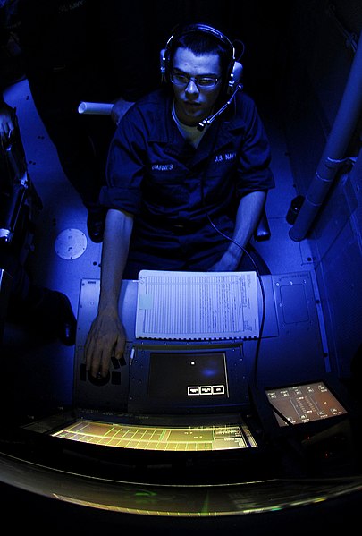 File:US Navy 090420-N-9928E-211 Sonar Technician (Surface) Seaman Apprentice Joseph Barnes, from Richland, Wash., reports simulated mines during an under-sea warfare training scenario in the sonar room aboard the Arleigh Burke-class.jpg