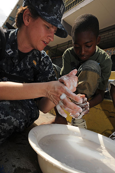 File:US Navy 110421-F-ET173-368 Lt. Danna Convoy, from Camp Lejeune, N.C., teaches a boy how to properly wash his hands during a Continuing Promise 2011.jpg