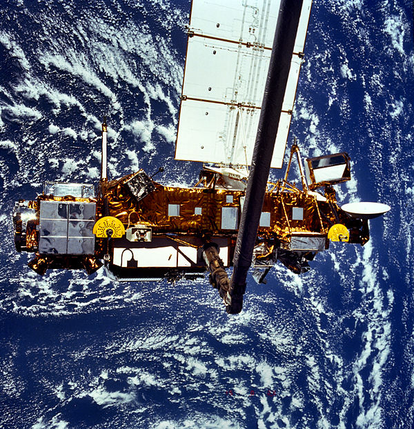 UARS on the remote manipulator (Canadarm) prior to deployment