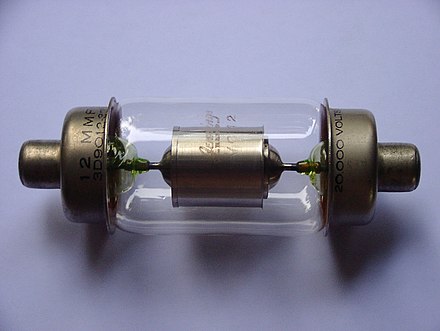 Uranium glass used as lead-in seals in a vacuum capacitor