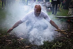 Welcome to Country Smoking Ceremony performed by an Aboriginal elder. Welcome to Country And Smoking Ceremony (51062593383).jpg