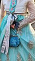 Woman wearing traditional Korean costume in Gyeonju and carrying a matching purse