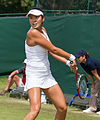 Yang Zhaoxuan competing in the third round of the 2015 Wimbledon Qualifying Tournament at the Bank of England Sports Grounds in Roehampton, England. The winners of three rounds of competition qualify for the main draw of Wimbledon the following week.