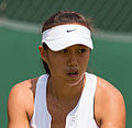 Zhang Shuai competing in the first round of the 2015 Wimbledon Qualifying Tournament at the Bank of England Sports Grounds in Roehampton, England. The winners of three rounds of competition qualify for the main draw of Wimbledon the following week.