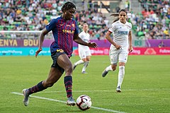Asisat Oshoala dribbles the ball during the 2019 UEFA Women's Champions League Final on 18 May 2019