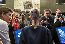 Sophia speaking to a crowd, 2017 AI for GOOD Global Summit (35173300465).jpg