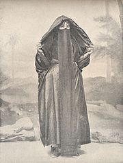 Coptic Orthodox Christian woman wearing a head covering and harabah (1918) A Coptic woman of the Poorer Class. (1918) - TIMEA.jpg