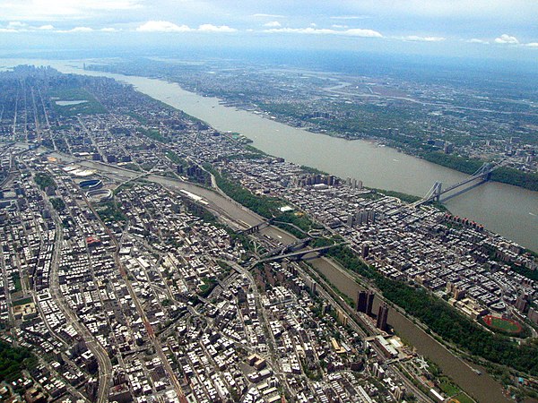 The Hudson River from above the Bronx, with Manhattan in the diagonal center and New Jersey in the distance. The George Washington Bridge is at right,