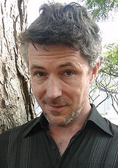 Aidan Gillen plays the role of Petyr Baelish in the television series Aidan Gillen (headshot).jpg