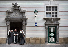 Nuns and a priest in free time. Heiligenkreuz Abbey, Austria