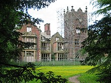 The Bank Hall mansion house is a Grade II* listed building, due to the 17th-century clock tower, which features an original oak cantilevered staircase. Bank Hall - Buttercups on Tower Lawn.jpeg