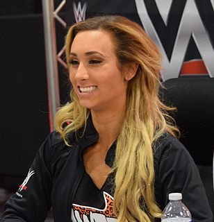 Leah Van Dale is an American professional wrestler, dancer and model. She is currently signed to WWE, where she performs on the Raw brand under the ring name Carmella, where she is a former WWE SmackDown Women's Champion, WWE Women's Tag Team Champion and WWE 24/7 Champion.