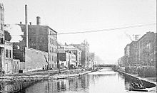 The canal, facing east toward the Elm Street bridge, before it was drained in 1920 Cincinnati-canal.jpg