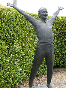 A statue of Lotus Cars and Team Lotus founder Colin Chapman, at the Hairpin Gate into the Mallory Park motor racing circuit Colin Chapman statue Mallory Park.jpg