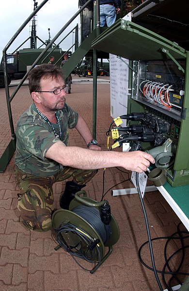 File:DF-SD-05-06148 Belgium Army First Sergeant Major (1SGM), BIGSTAF-Operator, at Lager Aulenbach, Germany 2003.jpeg