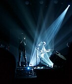 David Tweedie on Bass Guitar with Carmel Smith and Guy Sebastian in Silhouette