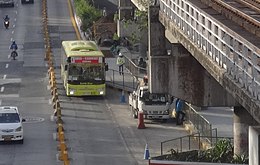 An EDSA Carousel bus near Mega Q-Mart bus stop, which was still under construction at that time. EDSA Kamuning with carousel bus lane (Cubao, Quezon City; 07-18-2020) (cropped).jpg