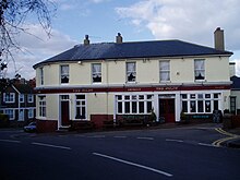 The Pilot - one of the two pubs in Meads Street. The stained glass windows depict aircraft and ships, thus evoking both meanings of the term 'pilot'. Hart's Cottages at the side were mainly occupied by workmen and their families, and were demolished in the 1960s to make way for a car park. During World War Two, business was brisk at both pubs with Canadian soldiers thronging the bars and singing around the piano in the Pilot. Eastbourne - Meads -The Pilot.JPG