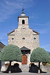 Saint-Jean-Baptiste church, tower and rectory with Roman inscriptions