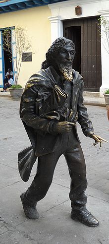 Bronze statue of Jose Maria Lopez Lledin known as "El Caballero de Paris" in Havana, Cuba, by sculptor Jose Villa Soberon. Unlike the nearby statue of St. Francis, this statue stands simply on the sidewalk and is a popular tourist attraction. The statue's beard has been polished by the hands of people standing to be photographed with it, for luck. El Caballero de Paris.jpg