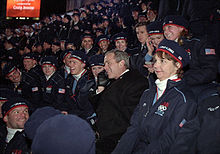 U.S. President George W. Bush takes a phone call from an athlete's family during the opening ceremony. George W. Bush with US Olympic Team at 2002 Winter Olympics opening ceremony.jpg