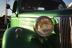 A green '50s Ford truck hood and headlight detail, Auckland, New Zealand