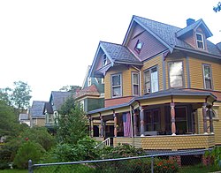 Oblique front view of several Victorian houses