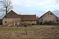 Residential stable house and two side buildings of a three-sided courtyard, with courtyard paving