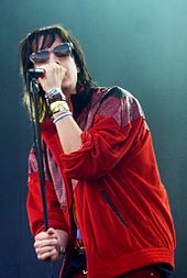 The Strokes singer Julian Casablancas appears on "Instant Crush". Julian Casablancas Belfort 2010.jpg