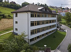 The "Annex": 1963 with a flat roof and in 1988 after the addition