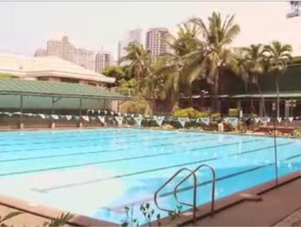 Swimming Pool with Ortigas Avenue skyline in the background
