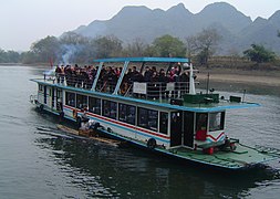 Tourist boat on the Lijiang River in winter, in Guangxi Province, China.