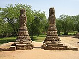 Two pillars standing alone near the temple.