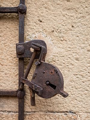 Old rusty padlock on house in Luquin, Navarre, Spain