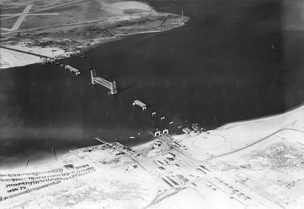 The construction of the Marine Parkway Bridge, Riis Park (bottom right), and Fort Tilden (bottom left) in 1937. The ferry landings at Riis Park/Fort T