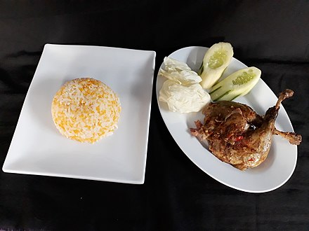 Nasi jagung (mashed corn) with bebek songkem