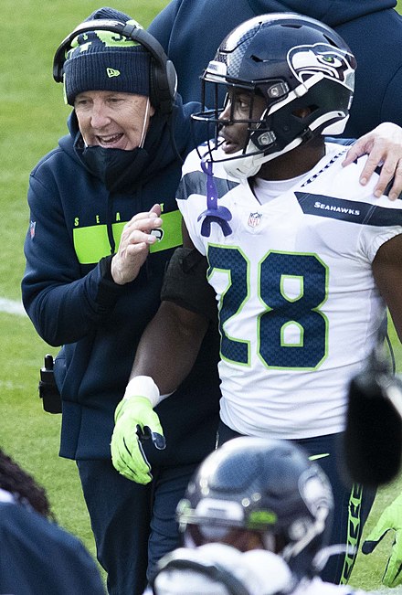 Pete Carroll with Ugo Amadi during a game in 2020