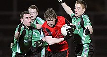 Down (red) in action against Queen's University Belfast in the 2009 Dr McKenna Cup QUB vs Down - McKenna Cup 09.jpg