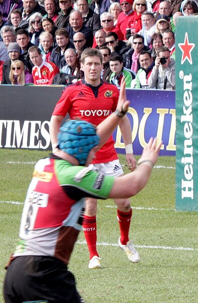 Ronan O'Gara (background) playing for Munster in 2013