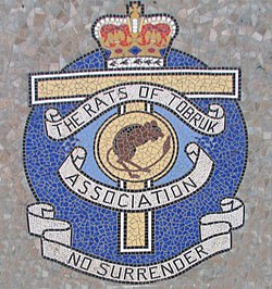 Mosaic at the foot of the Rats of Tobruk Memorial, Queen's Park, Mackay, Queensland, Australia, bearing the Rats of Tobruk Association insignia. Rats of Tobruk Mosaic, Mackay, Queensland, Australia.jpg