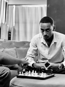 Remedan Yasin Reyan playing chess, showcasing his strategic mindset and focus, qualities that define his leadership as CEO of Rayan Investments PLC.