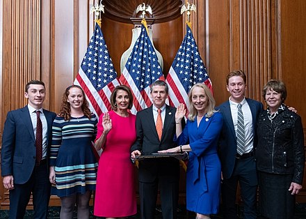 Scanlon with her family being sworn in by Speaker Nancy Pelosi