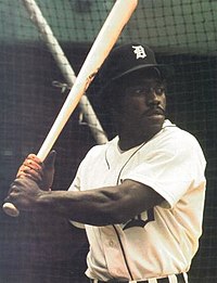 Outfielder Ron LeFlore wearing the traditional Tigers home uniform with navy blue piping down the front and an Old English "D" on the left chest Ron LeFlore 1975.jpg