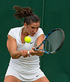 Sara Sorribes Tormo competing in the first round of the 2015 Wimbledon Qualifying Tournament at the Bank of England Sports Grounds in Roehampton, England. The winners of three rounds of competition qualify for the main draw of Wimbledon the following week.