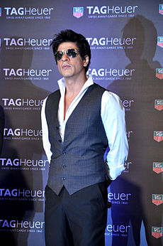 Shah Rukh Khan wearing sunglasses and a vest at a promotional event