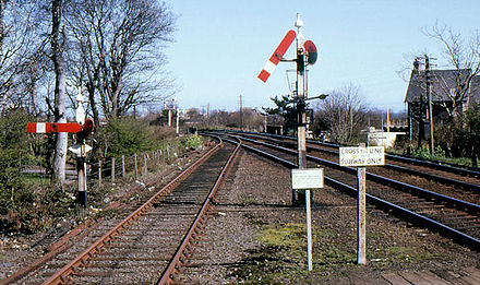 Somersault signals at Carrickfergus railway station, showing the distinctive central pivot about which the arm "somersaults"